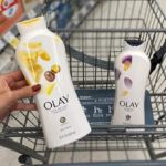 A Person Holding Olay Body Wash in an Aisle at Walgreens