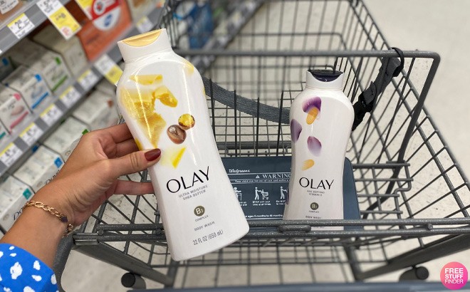 A Person Holding Olay Body Wash in an Aisle at Walgreens