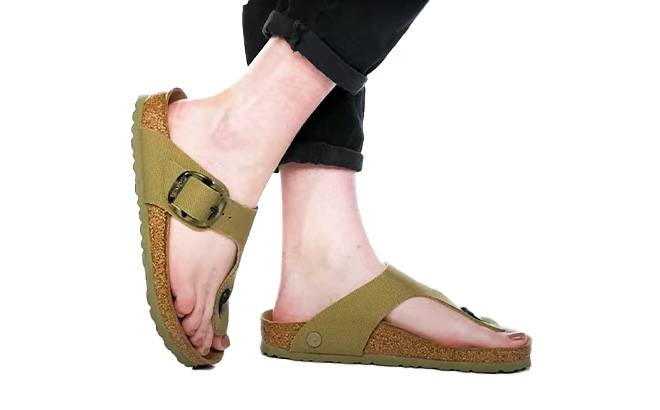 A Person Wearing Birkenstock Gizeh Big Buckle Canvas Sandals