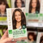 Hand Holding a Clairol Hair Color in an Aisle at Walgreens